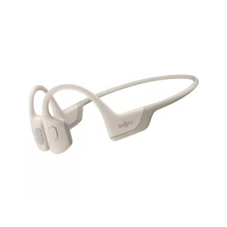 Shokz OpenRun PRO Bluetooth fülhallgató a fül előtt, bézs színben